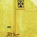 Old yellow door with window